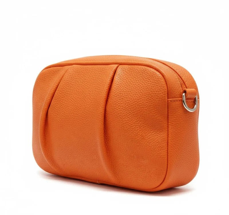 Orange leather pouch on a white background
