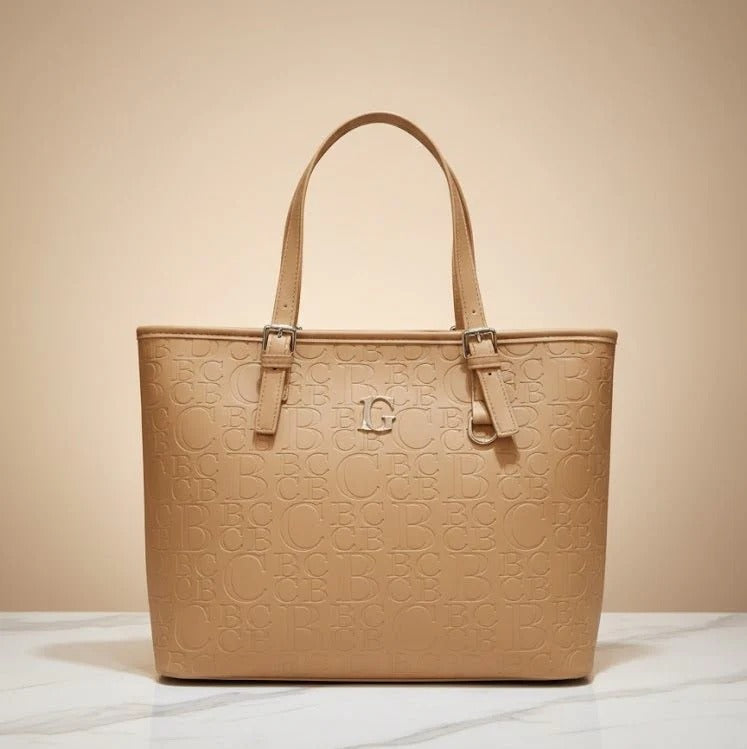 Beige handbag with embossed design on a beige background