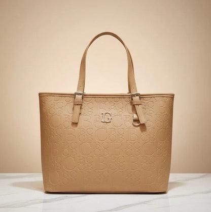Beige handbag with embossed design on a beige background